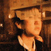 a blurry picture of a person with a party hat