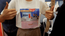 a person is wearing a t-shirt that says next station fever