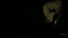 a close up of a person 's face with their mouth open .