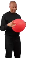 a man in a black shirt holds a red ball