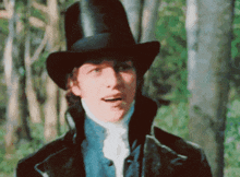 a man wearing a black top hat and a blue jacket