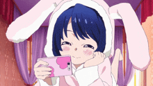 a girl wearing bunny ears is taking a selfie with her phone