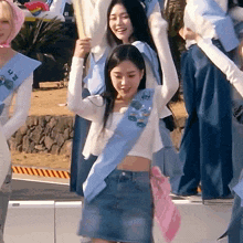a girl wearing a sash that says ' n ' on it