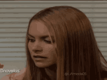 a close up of a woman 's face with the words tnovelas in the background