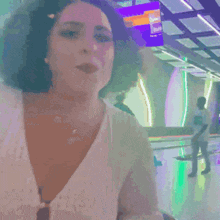 a woman in a white shirt is smiling with the name shagarita on the bottom