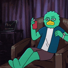 a green cartoon character is sitting in a chair holding a red can