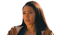 a woman wearing hoop earrings and a brown jacket is making a funny face