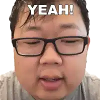 a man wearing glasses has the word yeah written on his forehead