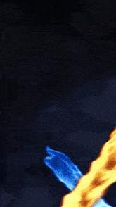 a blue and orange flame is coming out of a sword