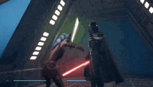 a woman is fighting a man with a red lightsaber in a video game .