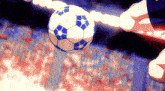 a blue and white soccer ball is being kicked by a player