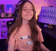 a woman wearing headphones and a t-shirt with a picture of a woman on it