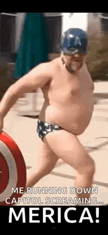 a man in a captain america costume is running down a sidewalk .