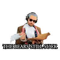 a man in a suit holding a book with the words " the bears still suck " below him
