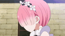 a girl with pink hair and flowers on her head