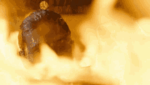 a close up of a person 's head surrounded by fire