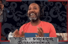 a man wearing headphones is laughing in front of a sign that says virgil sorceror urban bohemian
