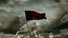 a flag on top of a rocky hill that says ' victory ' on it