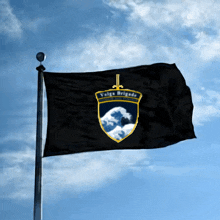 a black flag with a sword and the word valge brigade on it
