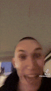 a person is making a funny face with their mouth open .