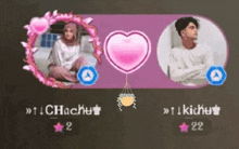 a man and a woman are sitting next to each other with a pink heart between them