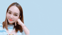 a woman 's face is behind a sign that says ' lsm u ' on it