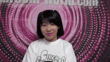 a young girl wearing a white shirt with cyber on it