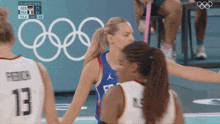 a female basketball player with the number 13 on the back of her jersey