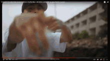a video of a man giving the middle finger is being played