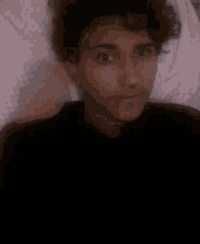a close up of a person 's face with their eyes wide open