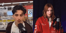 a man and a woman are singing into microphones in front of a microphone .