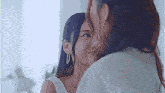 a man and a woman are looking at each other .