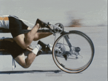 a blurred image of a person riding a bicycle with the words " low time machine " on the bottom
