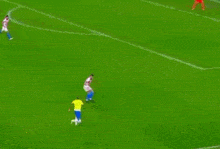 a soccer game is being played on a field with a betano banner in the background