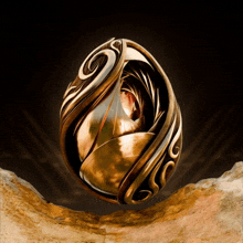 a gold ring with a swirl on it is on a rock