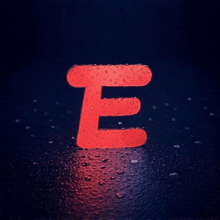 a red letter e surrounded by water drops