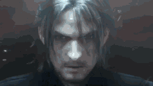 a person is standing in a dark room with a knife .