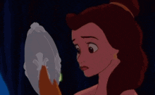 belle from beauty and the beast looks at a green light