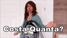 a woman is holding a vacuum cleaner with the words costa quanta written above her