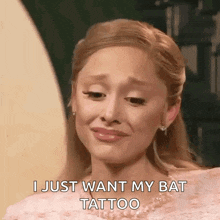 a woman in a pink dress is crying and says i just want my bat tattoo