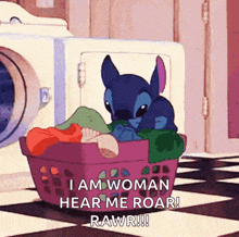 stitch is sitting in a laundry basket and says i am woman hear me roar rawr