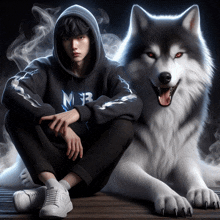 a man in a hoodie sits next to a large wolf