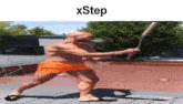 a bald man in orange shorts is holding a bat and the word xstep is on the bottom