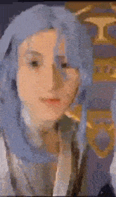 a close up of a person 's face with blue hair and a blurred background .