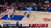 a basketball game between st. john 's and georgetown