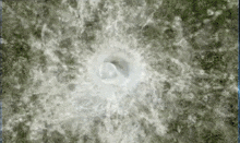 a close up of a hole in the ground with a circle in the middle