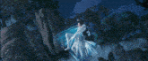 a woman in a white dress is standing in a foggy forest with her arms outstretched