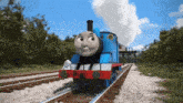 a thomas the train is going down the tracks