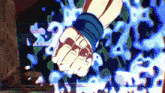 a close up of a person 's fist with a glowing background