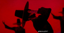 a silhouette of a man in a hat with the hashtag alexy8547
